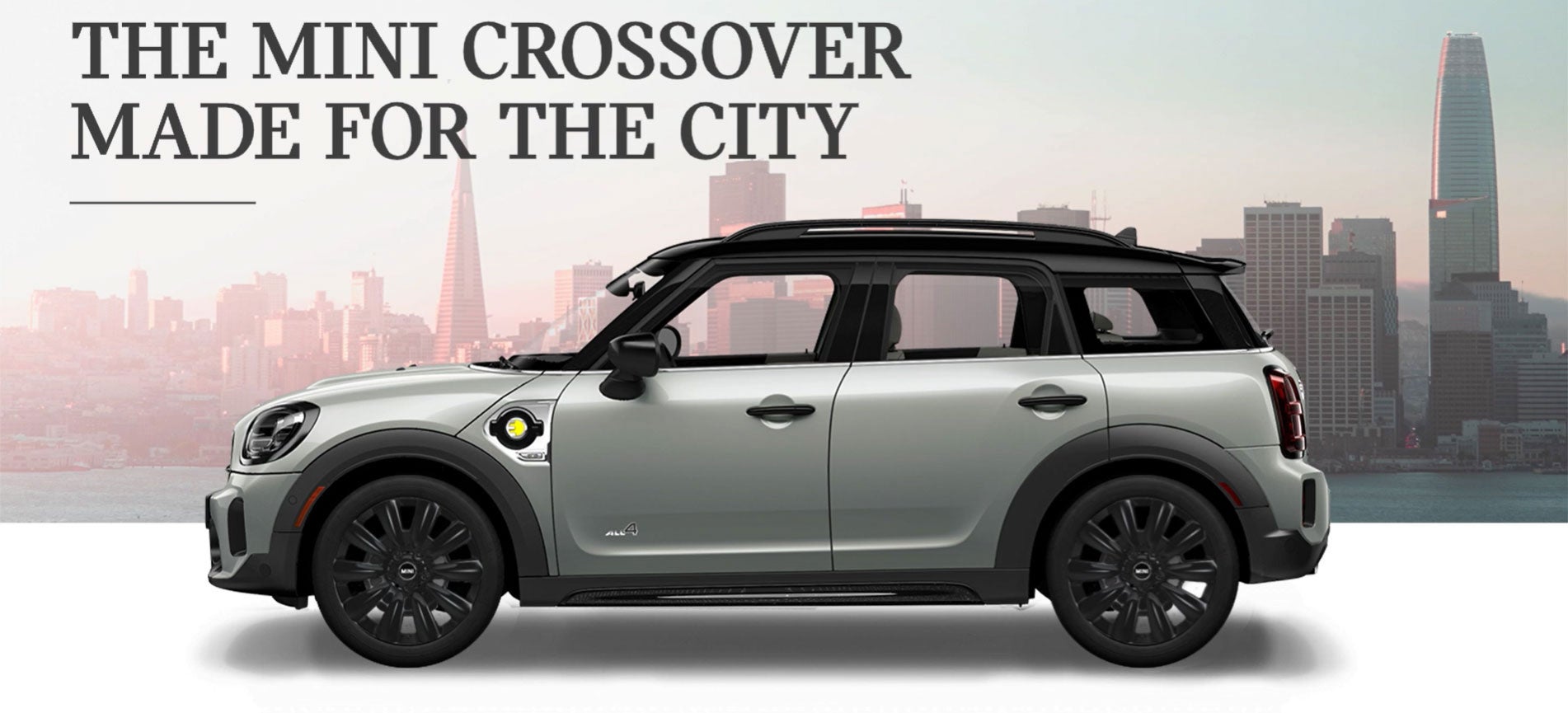 The MINI Cooper SE Countryman PHEV parked in front of a city scape. MINI of Edison in Edison NJ