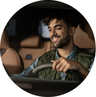 Alt Text: A close-up of man in the drivers seat of MINI Countryman SE ALL4.