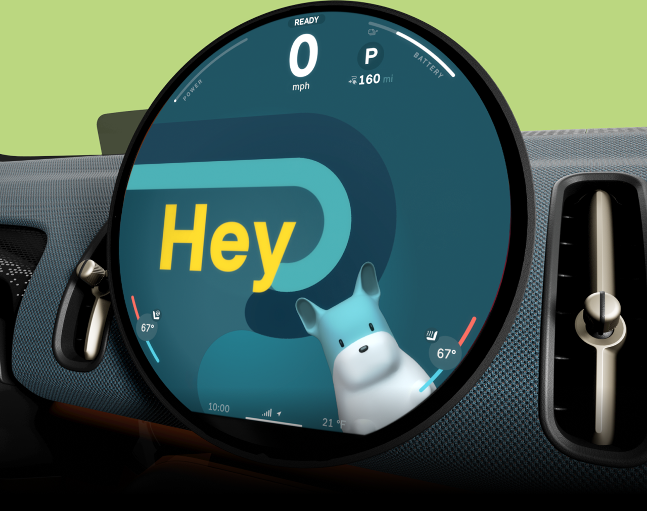 A close-up of the 9.4” round MINI OLED Display with MINI’s Intelligent Personal Assistant on the screen and text reading “Hey”