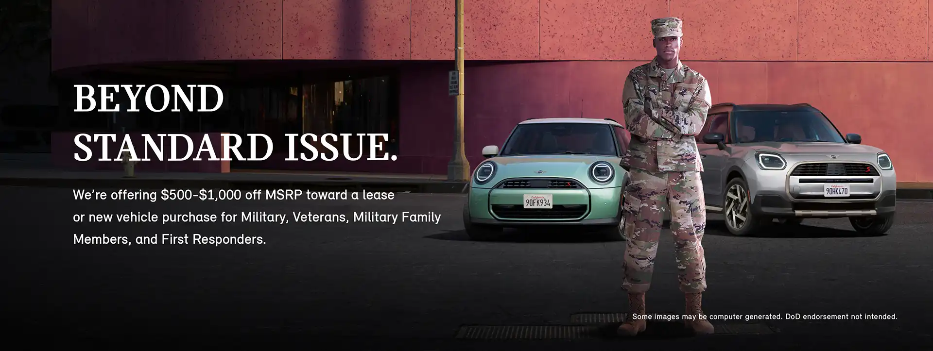 A man in a Military and First Responder uniform standing in front of a MINI Cooper S 2 Door and MINI Countryman S ALL4 with his arms crossed.