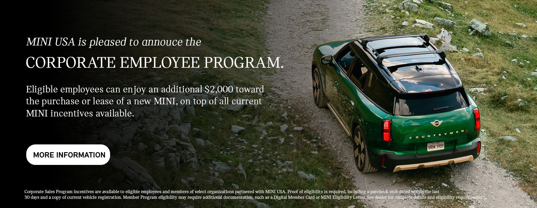 Back view of green countryman driving up hill.