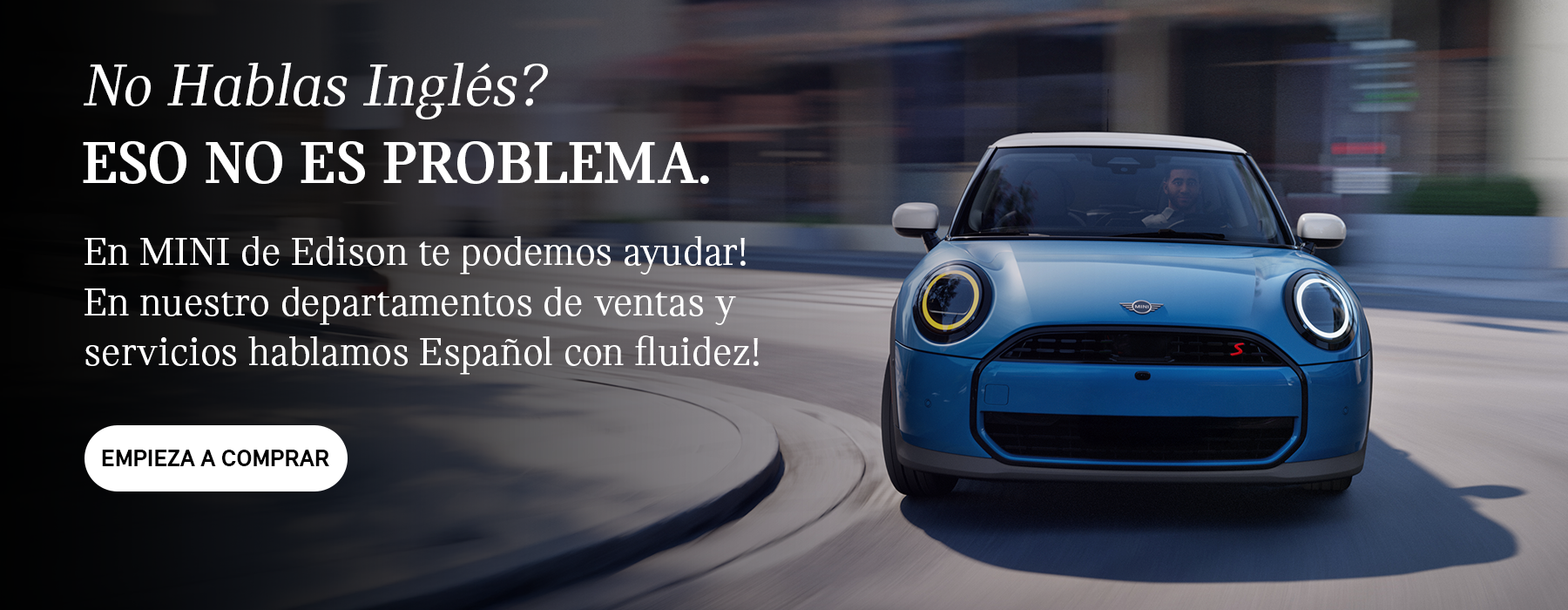 Front view of grey MINI Countryman on blue background.